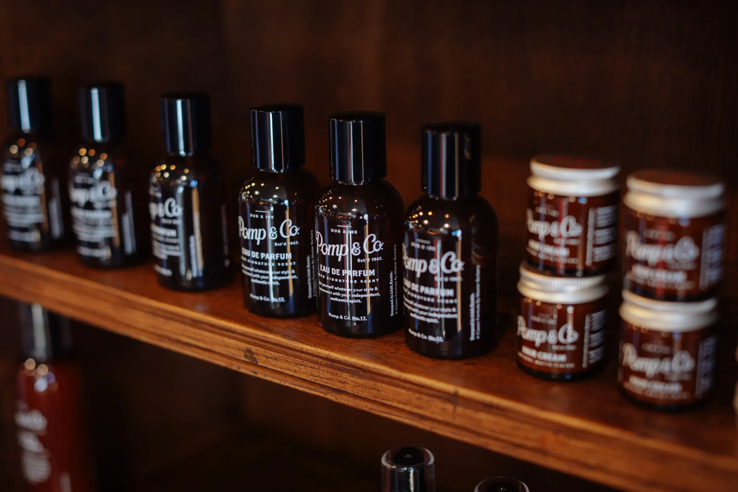 Pomp & Co. products on a barbershop counter